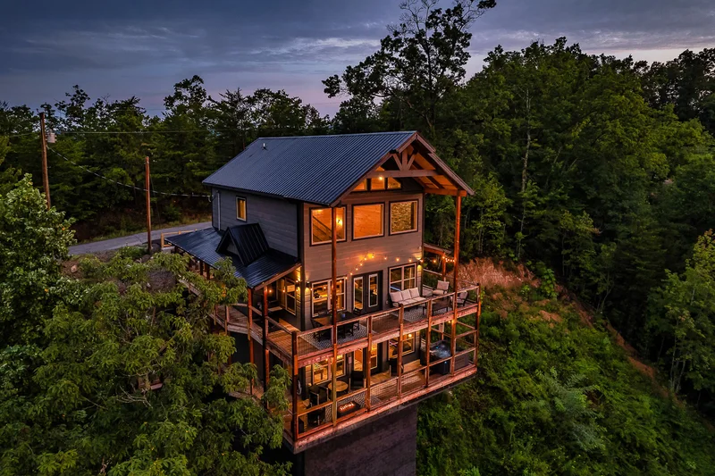 Elevated view of the cabin and its layered decks at dusk